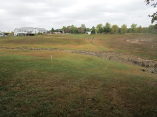 The "ditch" is just the result of erosion during the spring rains.  