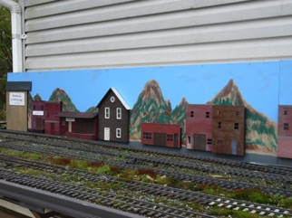 Ken has painted a backdrop along the back wall of the barn. The barn also serves as home for all the cars in between sessions.