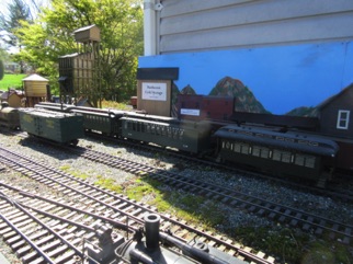 Trains are kept inside the shed, but brought outside for operations and stuck in the yard against the shed.