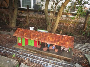 December 4.  The roof has been redone and McCown Freight has been re-painted and restored to its place on the layout.
