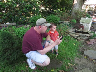 May 31.  My neighbors Andy and his son Max visit to watch the trains.