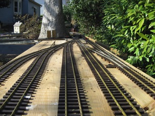 It's March 27 and I'm ready to work outside. Sunday was a great day to work on the layout, and I got most of my yard completed. I also realigned the track that connects it to the main line. 