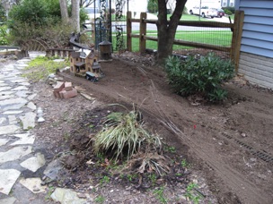 March 31: I took advantage of the fine day to put down 2 cubic yards of topsoil. 