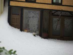 March 14.  It's a LOT of snow to the little boy peeking through the window of the 5 & 10.