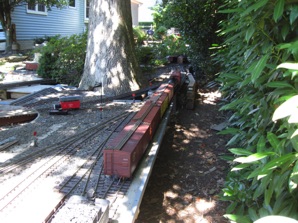 First the locomotive is separated from the train in preparation to run around it and push the cars into place in the yard.